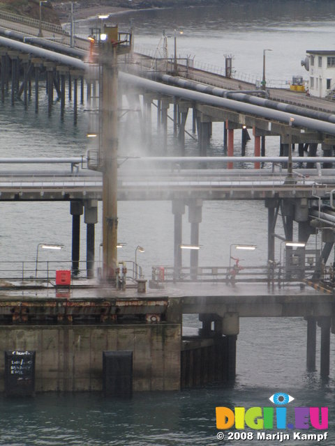 SX01183 Water spraying from oil tanker rig in Milford Haven